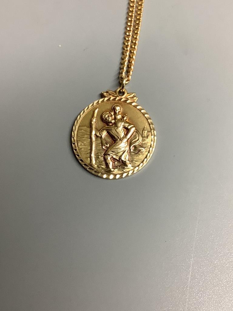 A 9ct gold St. Christopher pendant on a 375 chain, gross 11.8 grams.